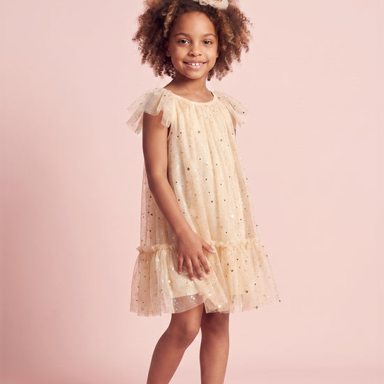 Girl wearing the Starlight Ivory Tulle Flower Girl Dress, front