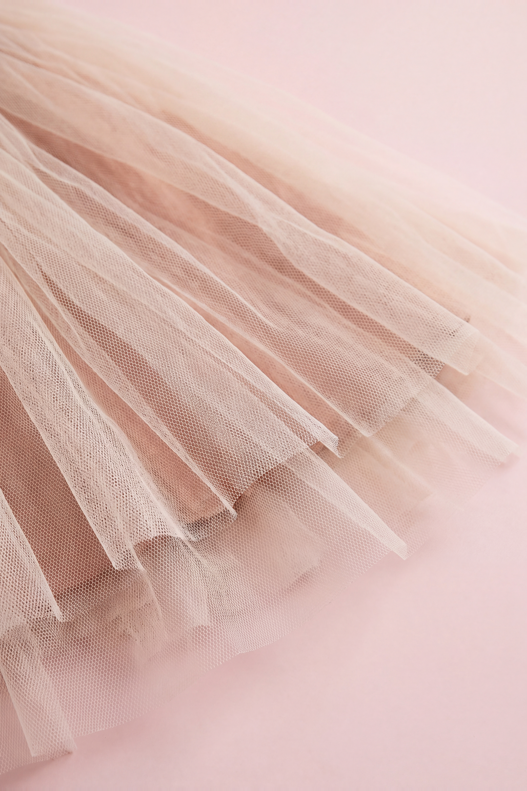 Cream tulle skirt hem over the caramel linen underskirt