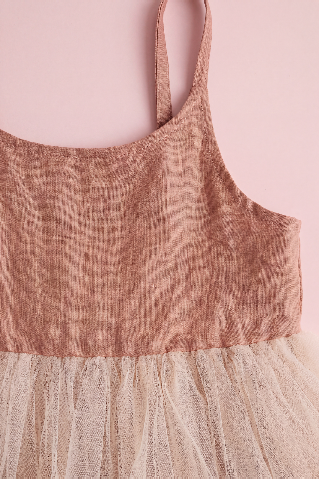 Caramel linen bodice detail with scoop neckline and topstitching