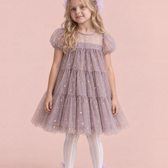 Girl wearing the Wisteria Bloom Lilac Star Tulle Dress, front