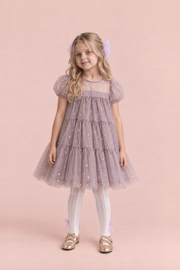 Girl wearing the Wisteria Bloom Lilac Star Tulle Dress, front