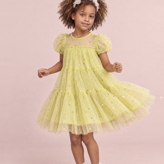 Girl wearing the Wisteria Bloom Lime Star Tulle Dress, front