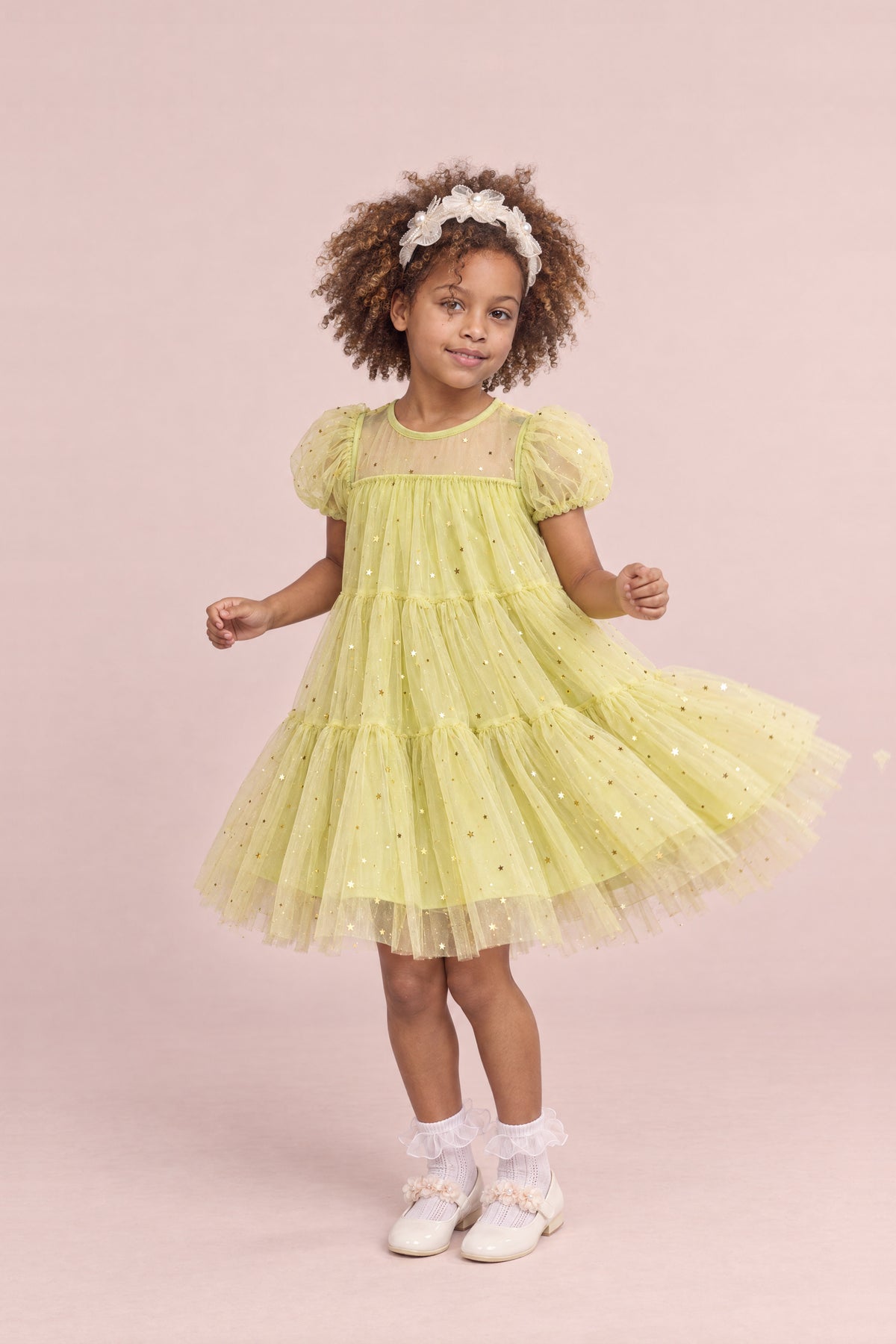 Girl wearing the Wisteria Bloom Lime Star Tulle Dress, front